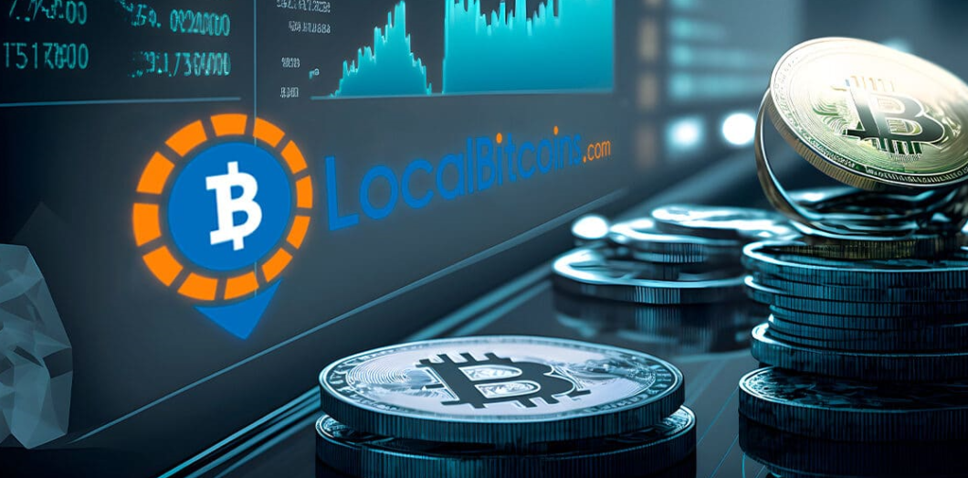 LocalBitcoins on the computer screen, Bitcoin coins on the side